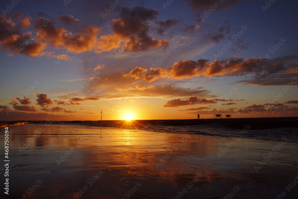 sunset with orange clouds and reflections sunset with orange clouds and reflections