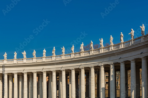Statues on top of the Colossal Tuscan colonnades in Piazza San Pietro (St Fototapeta