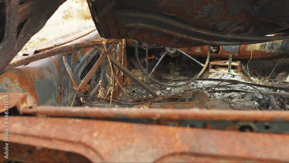 Interior of a burned and corroded rusty car Interior of a burned and corroded rusty car
