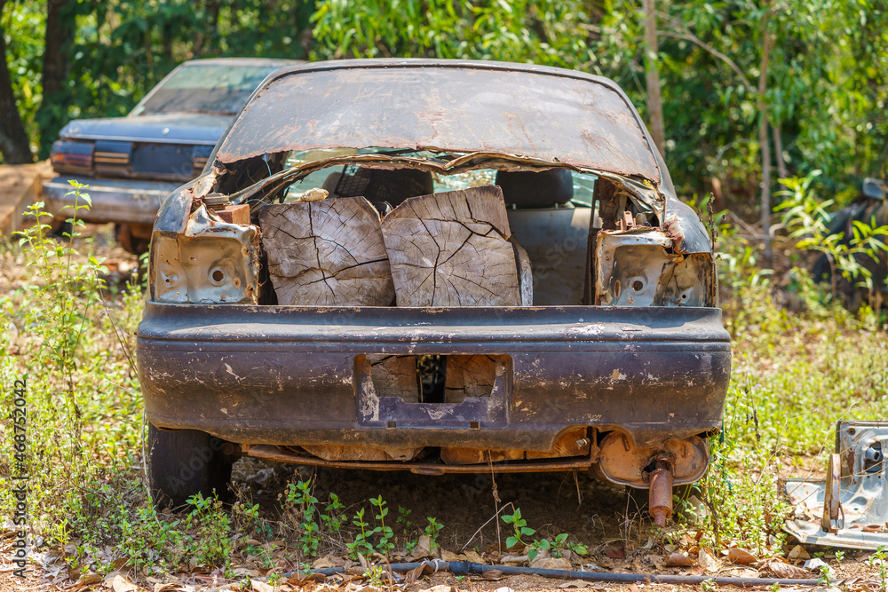 A car and illegal hardwood in northern Cambodia A car and illegal hardwood in northern Cambodia