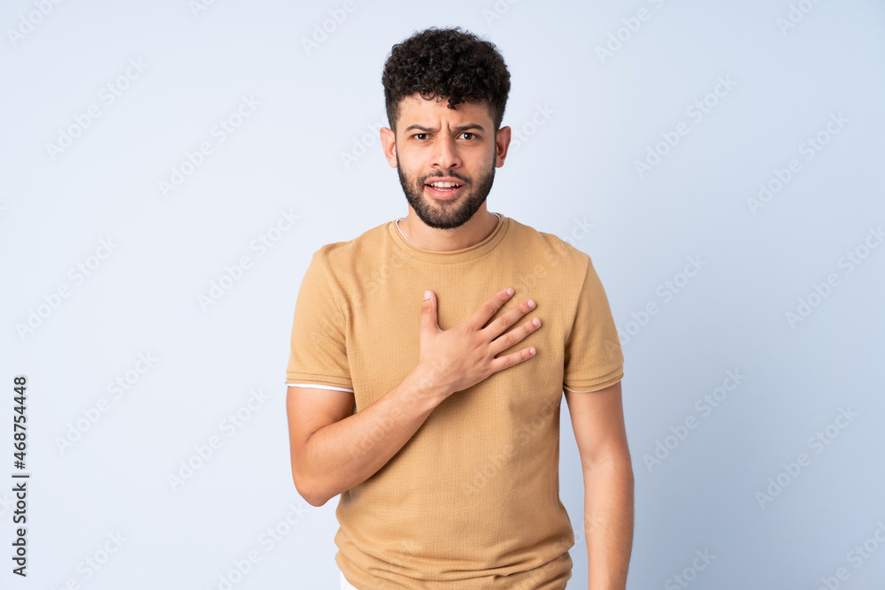 Young Moroccan man isolated on blue background pointing to oneself Young Moroccan man isolated on blue background pointing to oneself