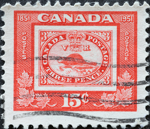 CANADA - CIRCA 1951: A postage stamp from Canada showing a postel stamp Reproduction of 3d stamp of 1851. Canadian Stamp Centenary photo