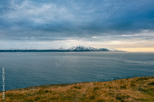 Wallpaper Mural Iceland Flateyjarskagi northern highlands ocean view with clouds over the sea and snow covered mountains Torontodigital.ca