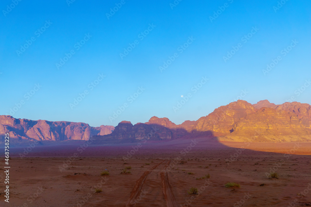 Fototapeta premium Cliffs and various rock formations, and the moon, Wadi Rum