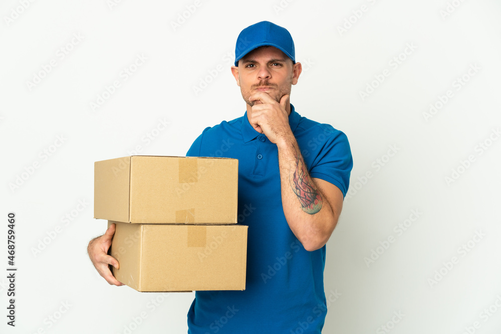 Delivery caucasian man isolated on white background thinking Delivery caucasian man isolated on white background thinking
