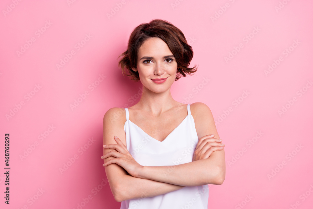 Portrait of attractive cheerful feminine cute girl folded arms isolated over pastel pink color background Portrait of attractive cheerful feminine cute girl folded arms isolated over pastel pink color background