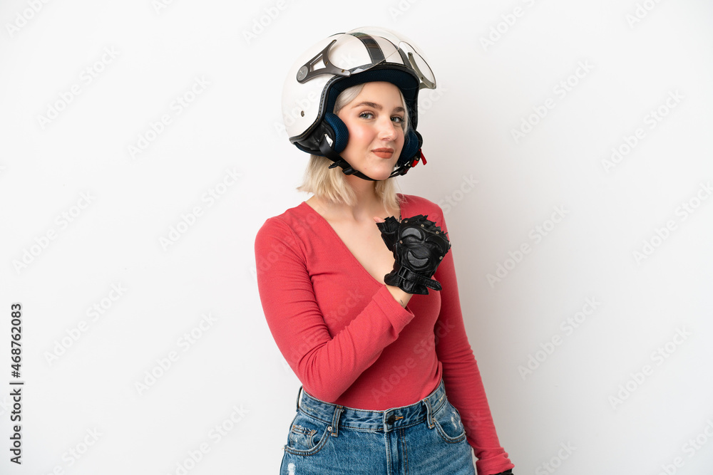 Young caucasian woman with a motorcycle helmet isolated on white background proud and self-satisfied Young caucasian woman with a motorcycle helmet isolated on white background proud and self-satisfied