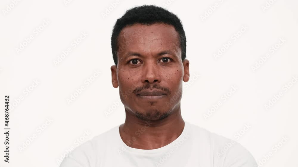 Smiling African man looking at the camera Smiling African man looking at the camera