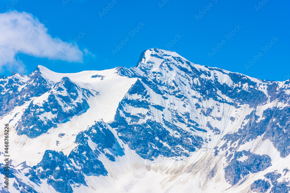 Alpine landscape of the snowy mountains at the border between Italy and France