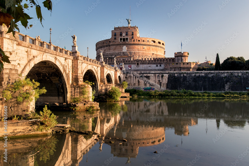 Castel Sant Angelo reflected in the tiber river.