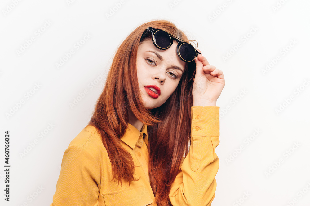 glamorous woman sunglasses red hair light background glamorous woman sunglasses red hair light background