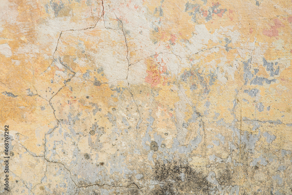 Old rough orange plaster wall surface Artistic. Walls and background, yellow concrete surface