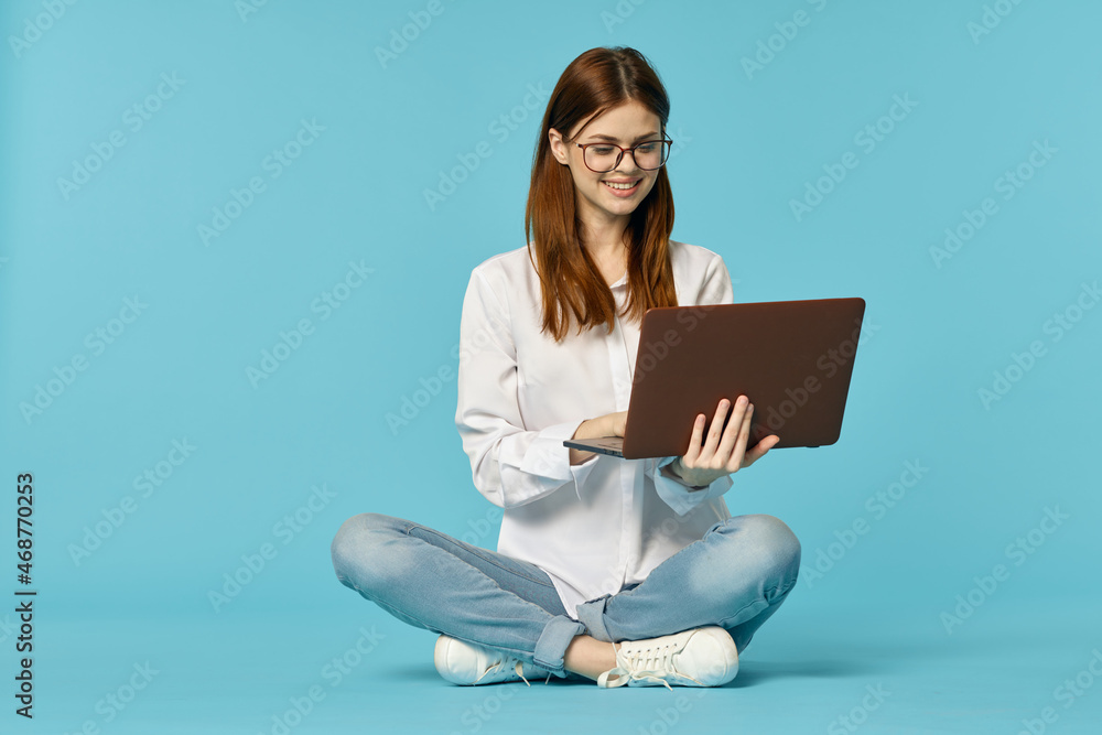 woman with laptop sitting on the floor learning student technology woman with laptop sitting on the floor learning student technology