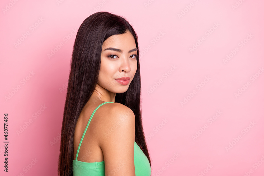 Photo of pretty charming young woman dressed green singlet smiling isolated pink color background Photo of pretty charming young woman dressed green singlet smiling isolated pink color background