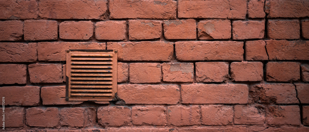 Old ventilation with a grill. In a brick wall. Stock Photo | Adobe Stock