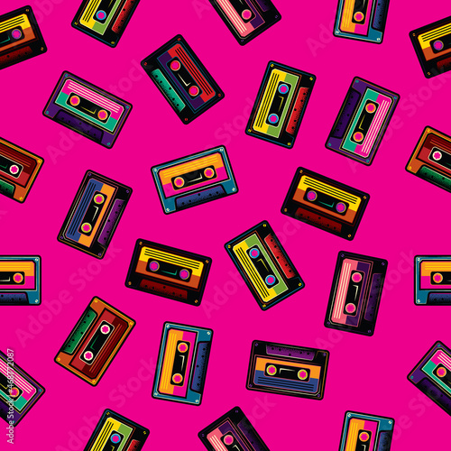 Original vector seamless pattern in vintage style. Old multicolored audio cassettes on a pink background.