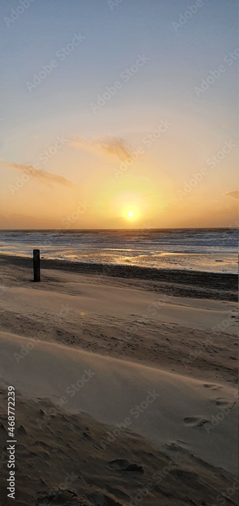 Sint Maartenszee Netherlands October 2021 colorful sunset over the sea in beautiful autumn weather Sint Maartenszee Netherlands October 2021 colorful sunset over the sea in beautiful autumn weather