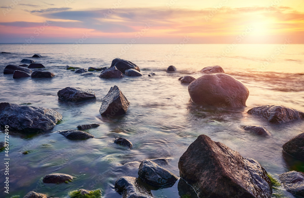 Rocky Baltic Sea beach at a beautiful sunset. Rocky Baltic Sea beach at a beautiful sunset.
