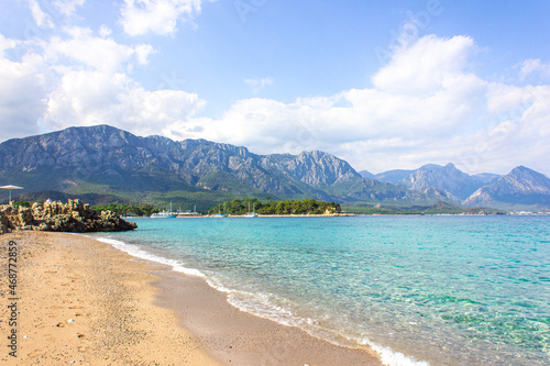 Seascape: clear blue sky, turquoise sea and mountains on the shore. Coastline of Kemer, Turkey. © Юлия Ненадовец