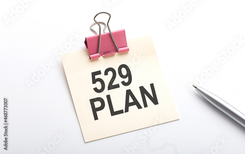 529 PLAN text on sticker with pen on the white background
