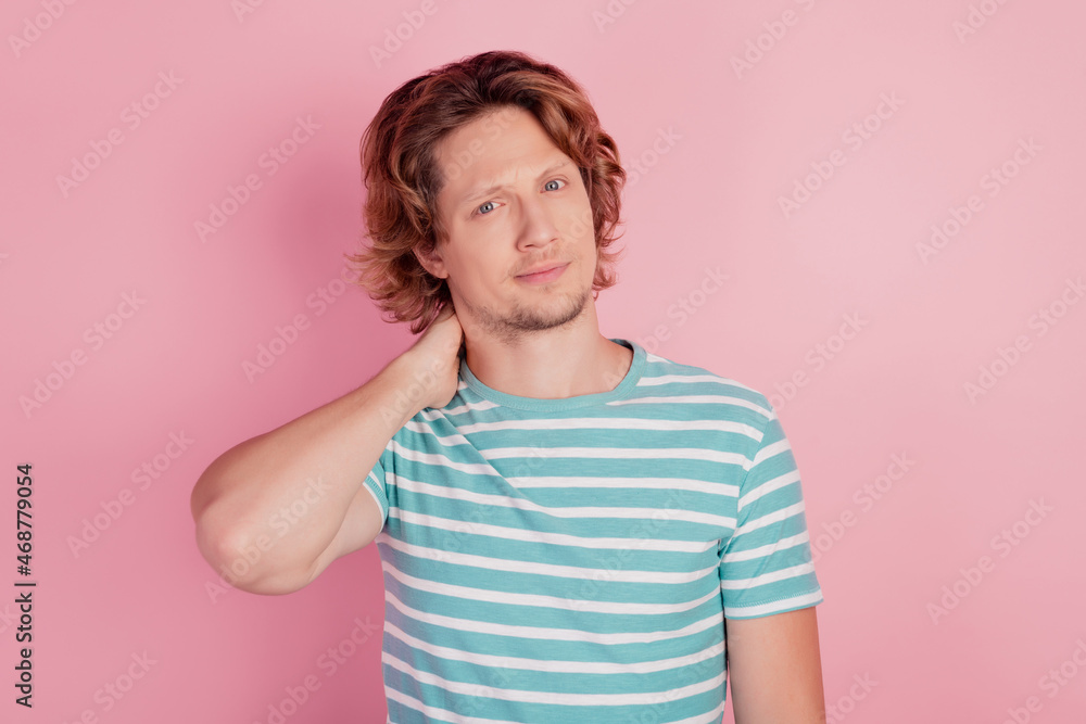 Clueless minded guy touch neck think look camera ponder Clueless minded guy touch neck think look camera ponder