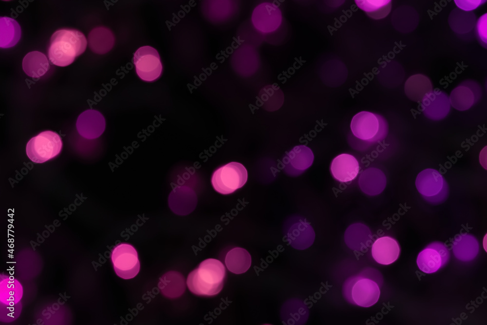 Defocused bokeh light on black background, an abstract naturally blurred backdrop for Christmas eve or birthday party. Festive light texture. Purple and pink garland blurred. Overlay effect for design Defocused bokeh light on black background, an abstract naturally blurred backdrop for Christmas eve or birthday party. Festive light texture. Purple and pink garland blurred. Overlay effect for design
