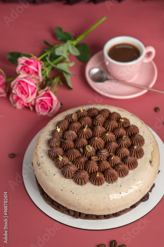 Coffee mousse cake with dark chocolate , sweet dessert over pink background