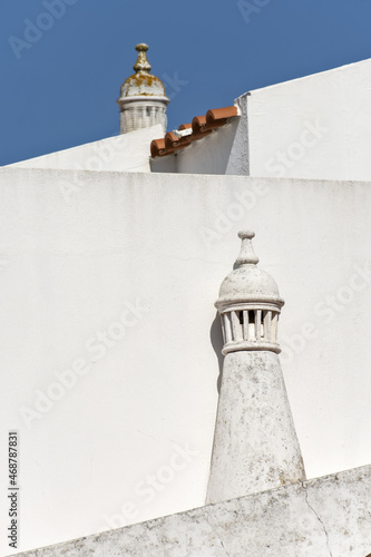 Close view of a traditional algarvian chimney on the city of Estoi in Faro district, Algarve, Portugal photo