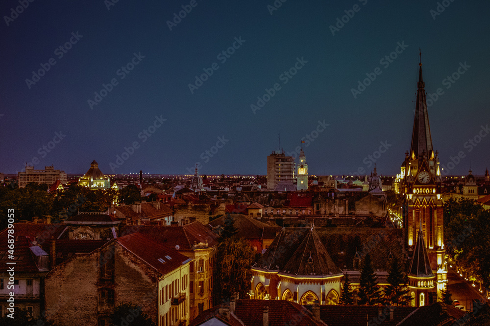 view of the city Arad at night, buildings and chapel