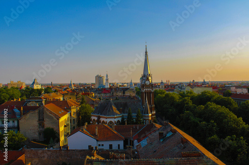 view of the city Arad in romania at sunset, buildings and chapel of city