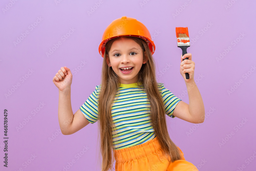 A very joyful and energetic girl is going to do repairs in the children's room. A very joyful and energetic girl is going to do repairs in the children's room.