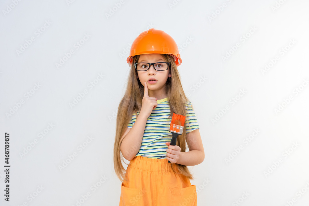 Indoor renovation. A little girl is planning an upcoming renovation in a new apartment. Indoor renovation. A little girl is planning an upcoming renovation in a new apartment.