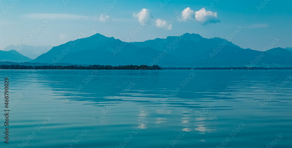 Beautiful alpine summer view with reflections at the famous Chiemsee, Bavaria, Germany