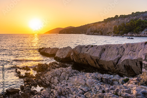 Fototapeta Naklejka Na Ścianę i Meble -  Beautiufl sunset on the rocky beach of Hvar Island, Croatia