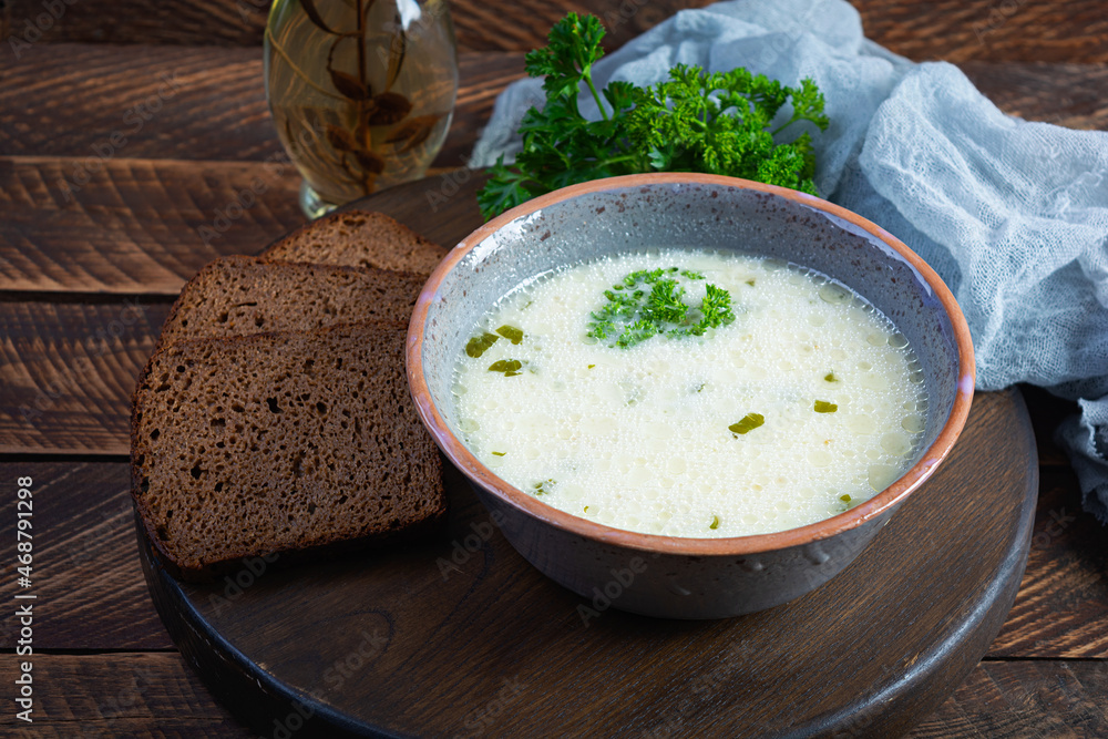 Delicious creamy beef soup. Vegetable creamy soup with beef, herbs and bread Delicious creamy beef soup. Vegetable creamy soup with beef, herbs and bread