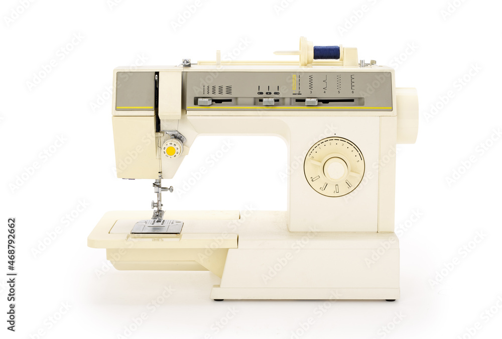 Front view of a sewing machine isolated on completely white background. Contains clipping path