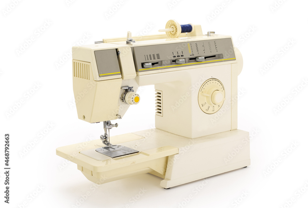 Sewing machine isolated on completely white background. Contains clipping path