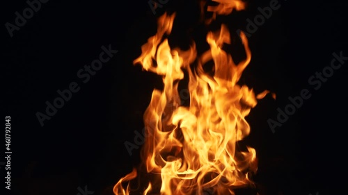 flames of fire on a black background in hell. hot fire burns hot. energy flammable concept. warm spark of fire fire hazard light gasoline effect photo