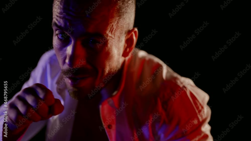 closeup portrait of aggressive drunk man, punching to camera, slow motion shot closeup portrait of aggressive drunk man, punching to camera, slow motion shot
