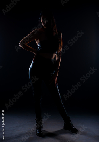 Silhouette of a girl posing in studio