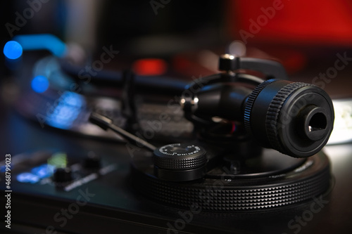 Turntables tone arm. Dj turn table player device in close up. Hi fi sound system for playing music in high quality