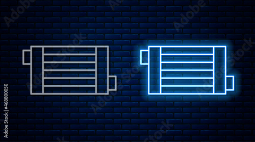 Glowing neon line Car radiator cooling system icon isolated on brick wall background. Vector
