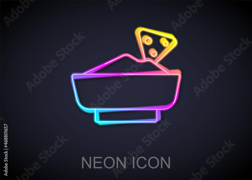 Glowing neon line Nachos in bowl icon isolated on black background. Tortilla chips or nachos tortillas. Traditional mexican fast food menu. Vector