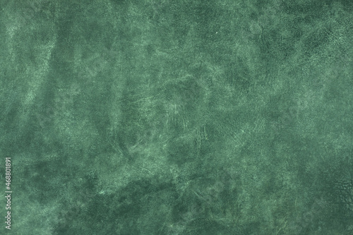 Beautiful green background with genuine leather texture