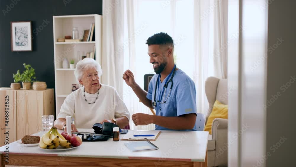 Happy healthcare worker or caregiver visiting senior woman indoors at home, measuring blood pressure. Happy healthcare worker or caregiver visiting senior woman indoors at home, measuring blood pressure.
