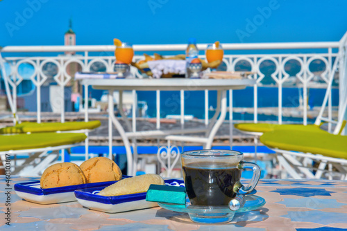 A cup of coffee with traditional Moroccan biscuits. Moroccan decoration. Tasty food breakfast.