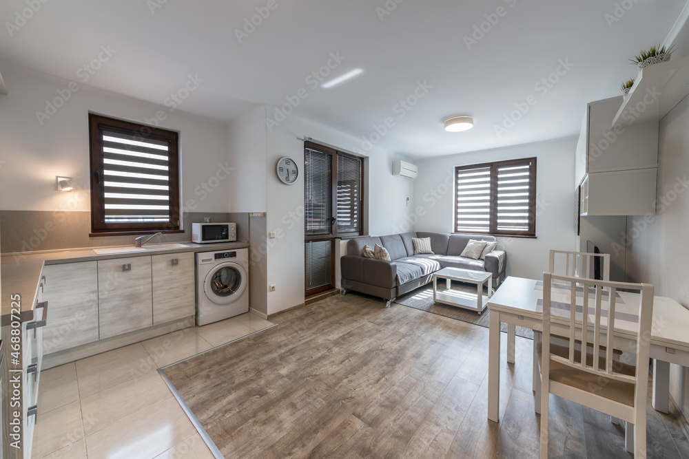 New modern living room with kitchen. New home. Interior photography. Wooden floor. New modern living room with kitchen. New home. Interior photography. Wooden floor.