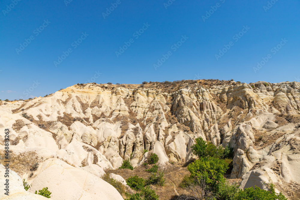 Panorama of unique geological formations at Cappadocia at sunny day, Central Anatolia, Turkey. Panorama of unique geological formations at Cappadocia at sunny day, Central Anatolia, Turkey.