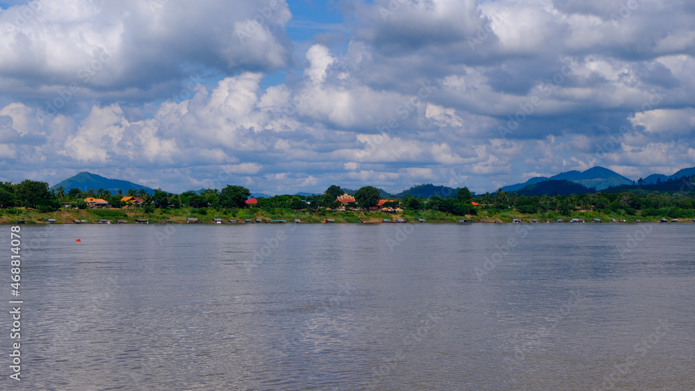 Houses on the riverside of Laos adjacent to Thailand. Houses on the riverside of Laos adjacent to Thailand.
