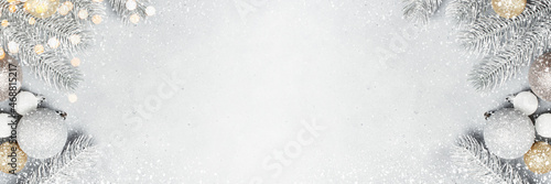 Christmas grey banner with frosted Christmas tree branches and baubles
